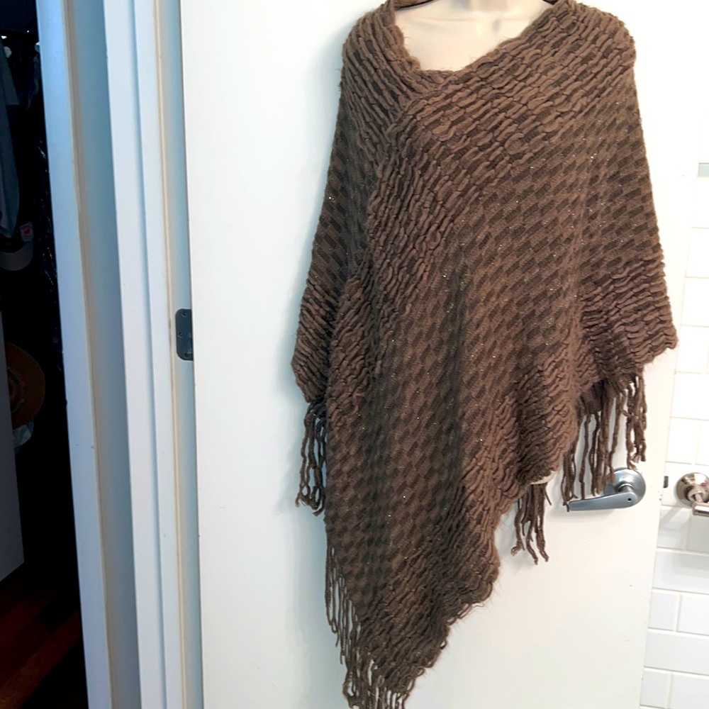 OS poncho for up to size 14.  Length depends on your size and build.